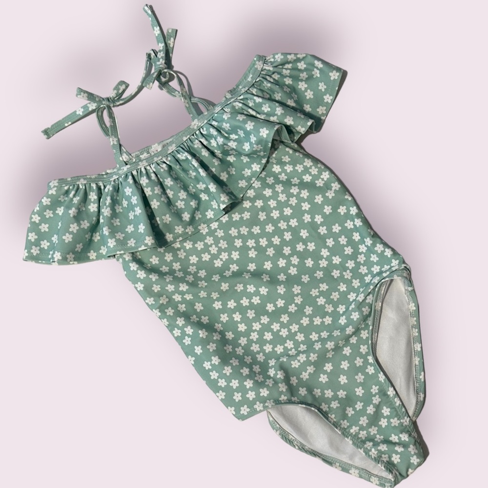 adorable brand new swim suit with ruffle neck line